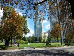 Rothschild Park in Frankfurt viewed from south with Bockenheimer Landstraße in the foreground, Park Tower in center, and the Opernturm on far right