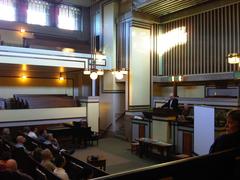 Unity Temple interior view with people walking, late to preservation event by CMAP