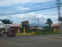 Antique wooden balangay boat displayed on the street