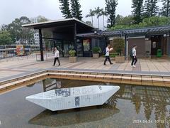 paper boats floating in a water pool art installation in Sai Kung Town Hong Kong