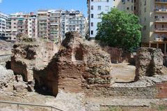 view of Thessaloniki with sea in the foreground and city buildings in the background