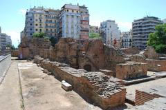 Panoramic view of Thessaloniki, Greece, featuring a mix of modern and historic buildings against a coastal backdrop