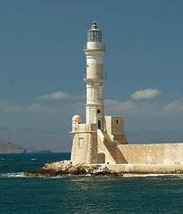 Chania Lighthouse in Crete, Greece, with calm sea and blue sky