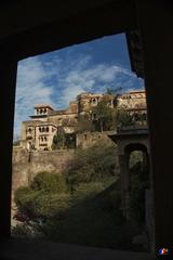 Alwar Fort view framed by a stone archway