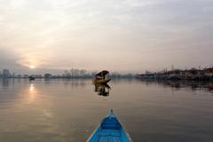 Boats on Dal Lake during sunset