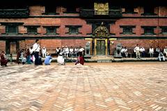 People in front of Patan Museum with Golden Gate in Kathmandu Valley, Nepal