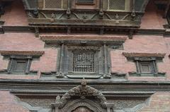 Artistic wooden window and door at Patan Durbar in Nepal