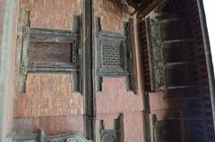 Artistic wooden window and door at Patan Durbar Square in Nepal