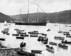 Three-masted sailing ship Cutty Sark surrounded by row boats at Fowey Regatta in 1924