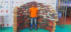 Uttap Kishor Banua standing in front of Book Showcase at Book Fair in Bhubaneswar