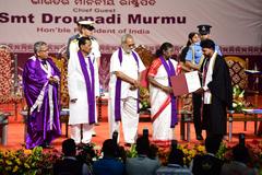 Mr. Sangram Sahoo receiving a gold medal from President of India, Smt. Droupadi Murmu, at Maharaja Sriram Chandra Bhanja Deo University's 12th Convocation