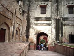 Agra Fort view with red sandstone walls and green lawn