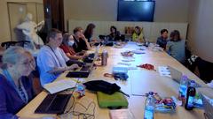 group of people participating in an Editathon event for Munich's female writers