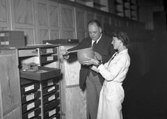 Axel Bagge and colleagues in a storage room at the Swedish History Museum