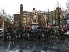 Rembrandtplein in Amsterdam at dawn with statues of The Night Watch