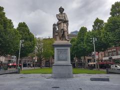 Rembrandt Monument and surrounding buildings on Rembrandtplein, Amsterdam on a cloudy day