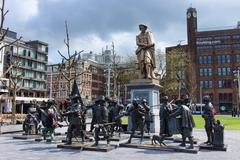 Rembrandtplein with statues representing a painting by Rembrandt