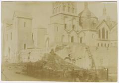 elevation of the cloister wall, with Périgueux Cathedral in the background, and eight people in the foreground