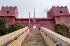 Red tower in Malta with clear blue sky