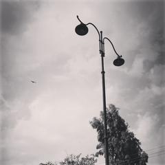 street lamps on a road in Faisalabad at night