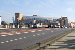 A308 Kingston Bridge in Kingston upon Thames, UK, spanning the River Thames with traffic passing over and clear blue sky