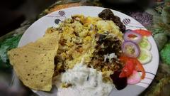 Biryani of Ranchi plated with a side of salad