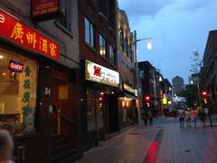 Chinatown street with colorful signs in English and Chinese and shops on either side