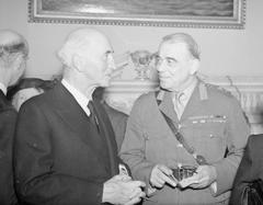 General Sir Hastings Ismay conversing with Sir John Simon at a farewell dinner