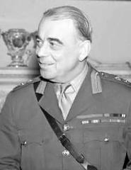 General Sir Hastings Ismay in military uniform seated at a dinner table