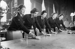 WRNS stewards laying the table in the mess at the Royal Naval College, Greenwich, 1942