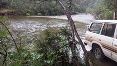 Landcruiser HJ60 crossing the Upper Murray River