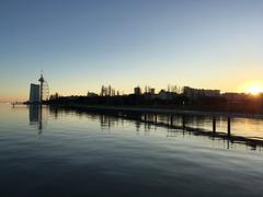 Panoramic view of Lisbon cityscape with historic buildings and River Tagus in the background