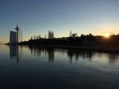 Panoramic view of Lisbon's cityscape with a river and bridge