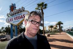 Poet Bruce Isaacson with Welcome to Las Vegas sign