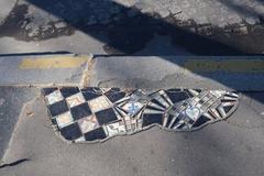 mosaic on the sidewalk at the intersection of Avenue Georges-Mandel and Place du Trocadéro in Paris