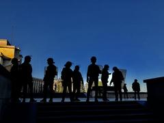 CRS officers silhouetted against Trocadéro during Yellow Vests protest