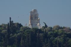 Mausoleum or Monument to Gaius Julius Antioco Epiphanes Filopappo viewed from the Acropolis with olive trees, aleppo pines, and cypresses