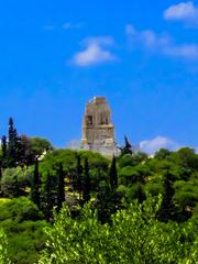 Ruins of Acropolis in Athens under a blue sky