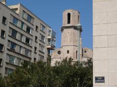 Rue des Martégales building reconstruction with Saint-Laurent Church in background