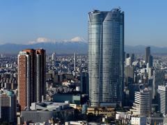 Roppongi Hills in winter morning with snowy Mount Fuji and Tanzawa Mountains in the background