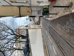 Lisbon cityscape featuring a tram on a cobblestone street