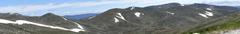 Panoramic view of the Australian Alps featuring mountains, greenery, snow, and a tranquil atmosphere