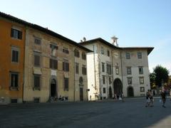 Palazzo dell'Orologio in Pisa with a clock tower and intricate architectural details