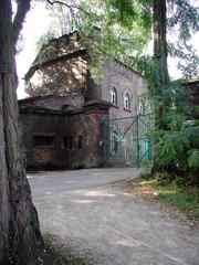 Coeln Fort X building with green roof and surrounding trees