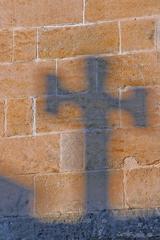 Shadowed cross in Arles, France