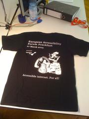 EAFRA T-Shirt 2009 featuring comic characters and accessibility slogan