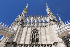 Duomo di Milano featuring intricate marble facade and gothic architecture