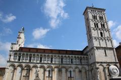 Panoramic view of Lucca's historic center with medieval buildings and red-tiled roofs