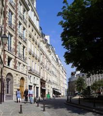 Dauphine place in Paris with historical buildings and cobblestone street