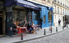 Place Dauphine in Paris with a café in the foreground